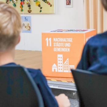 Ein Würfel mit dem Aufdruck "11 nachhaltige Städte und Gemeinden"